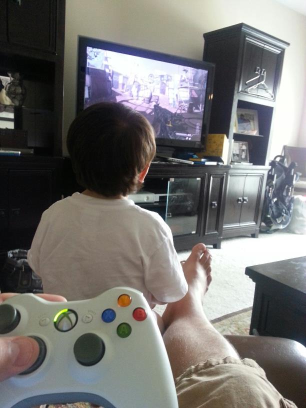 Gus playing Modern Warfare with daddy
